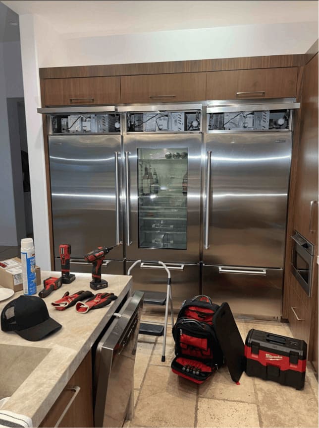 Sub-Zero repair in Miami — three built-in Sub-Zero refrigerators serviced in a Miami kitchen